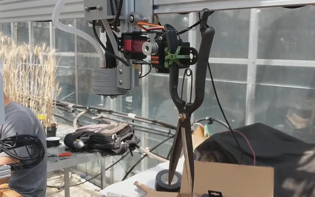 Servo-operated pruning shears mounted on the FarmBot